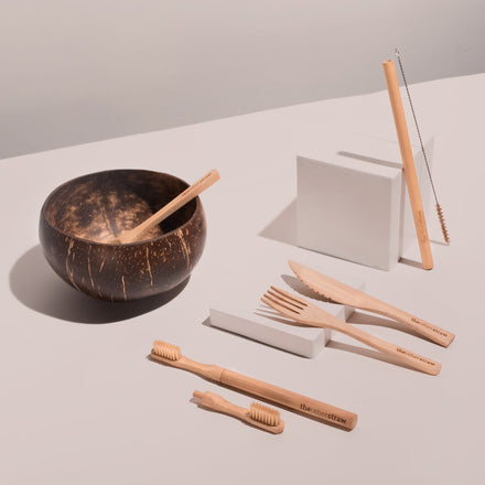 bamboo straws, bamboo cutlery, bamboo toothbrush and coconut bowl