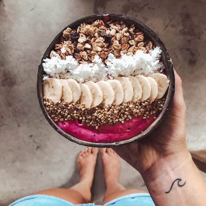 acai bowl in a coconut bowl theotherstraw
